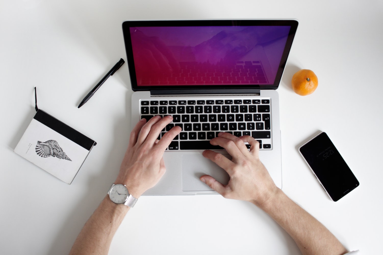 image of someone on a laptop utilising shared hosting
